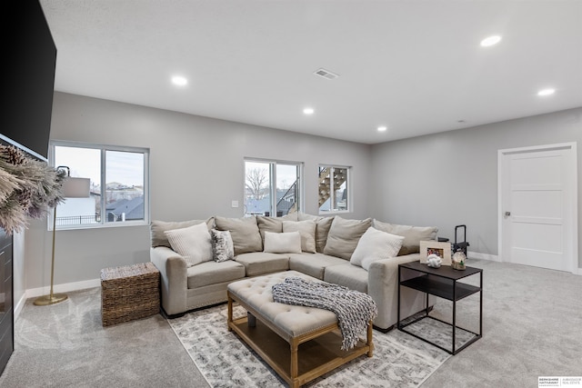 living room featuring light colored carpet