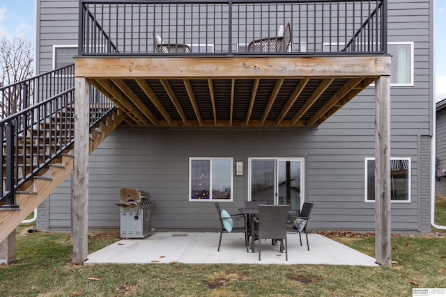 rear view of property with a patio area and a yard