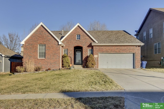 view of front property featuring a front lawn and a garage