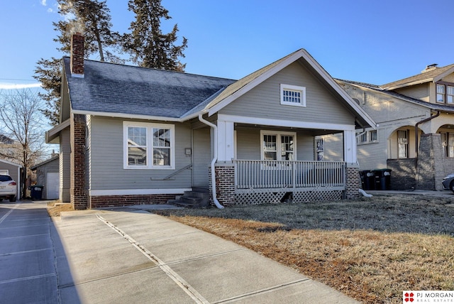 view of front facade with a porch and a garage