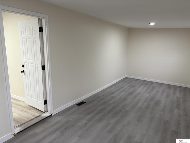 unfurnished room with hardwood / wood-style floors