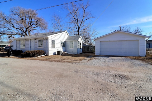 view of front of house with central AC unit and a garage