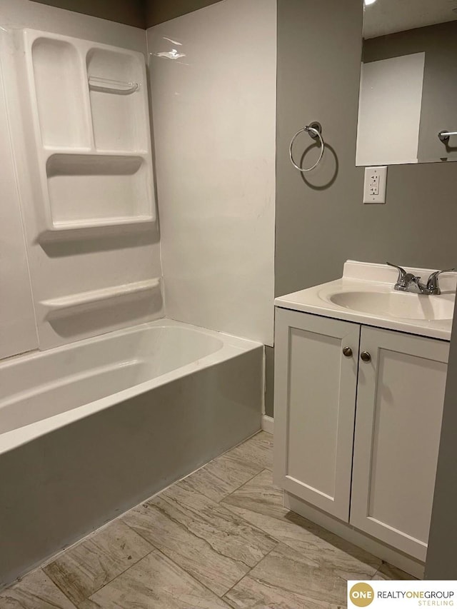 bathroom featuring vanity and bathtub / shower combination