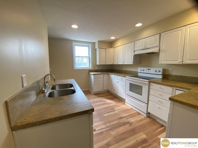 kitchen with white cabinetry, sink, white range with electric stovetop, and light hardwood / wood-style floors