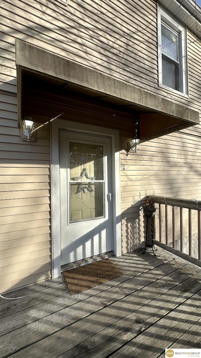 entrance to property with a wooden deck