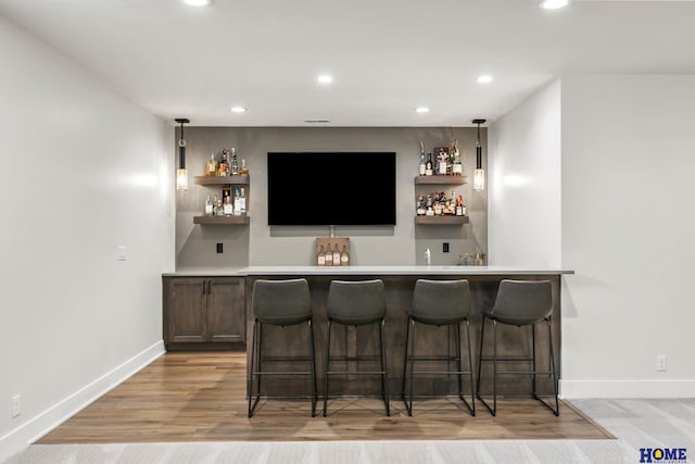 bar with light wood-type flooring