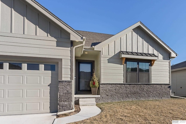 view of front of property with a front yard and a garage