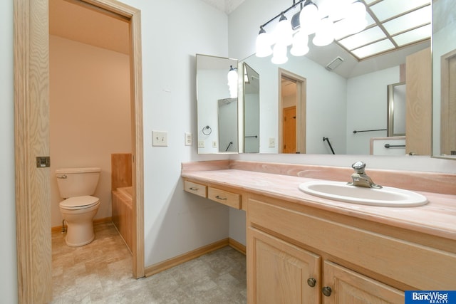 bathroom with toilet, a bathtub, and vanity