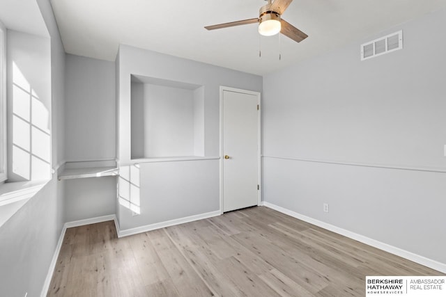 interior space featuring ceiling fan and light wood-type flooring