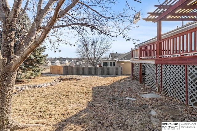 view of yard with a wooden deck and a pergola