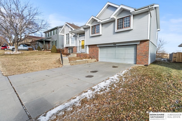 view of front of home featuring a garage and a front lawn