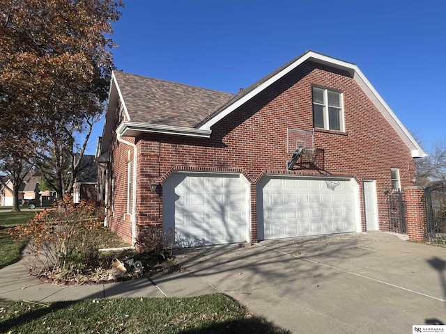 view of side of property with a garage