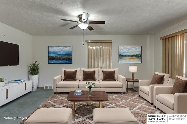 carpeted living room featuring ceiling fan