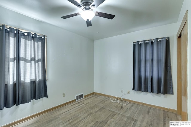 unfurnished room featuring wood-type flooring and ceiling fan