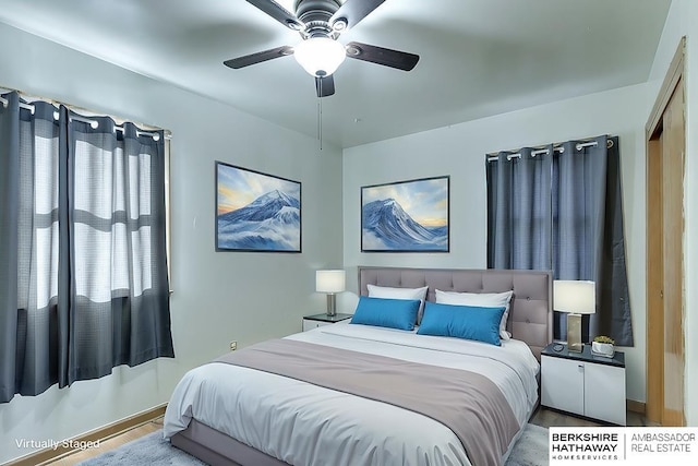 bedroom featuring ceiling fan and hardwood / wood-style floors