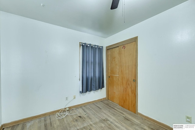 empty room with light hardwood / wood-style floors and ceiling fan