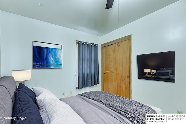 bedroom with ceiling fan and a closet