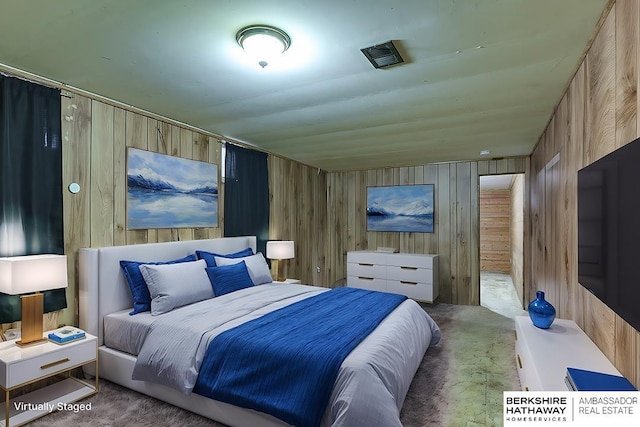 bedroom with wood walls