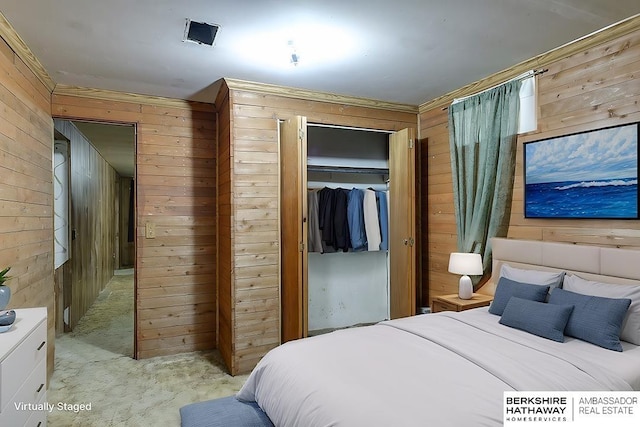 carpeted bedroom with wooden walls and a closet