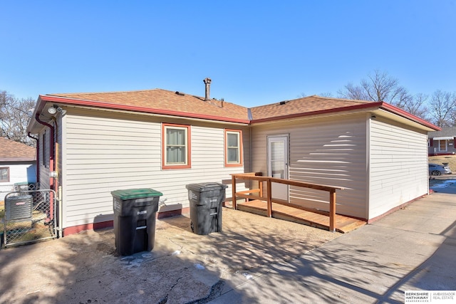 rear view of property featuring a patio area and central AC unit