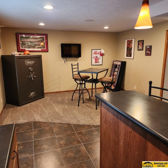 carpeted dining space with bar