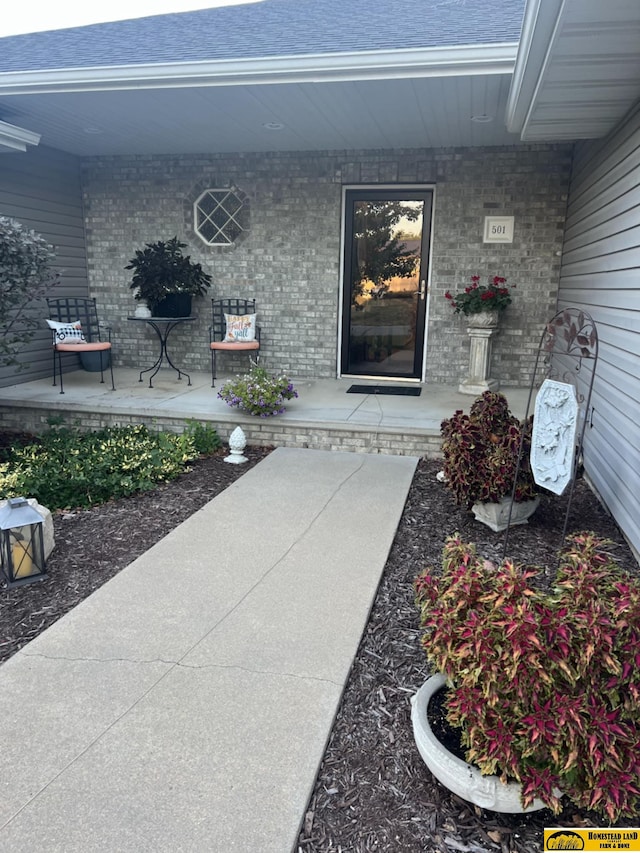 doorway to property featuring covered porch