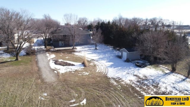 view of yard layered in snow