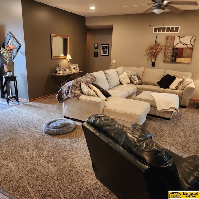 carpeted living room featuring ceiling fan