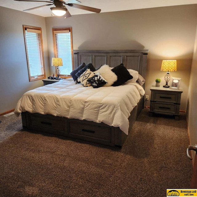 bedroom featuring ceiling fan and dark colored carpet