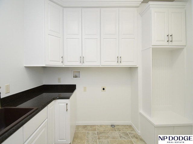 laundry area with hookup for a washing machine, cabinets, hookup for an electric dryer, and sink