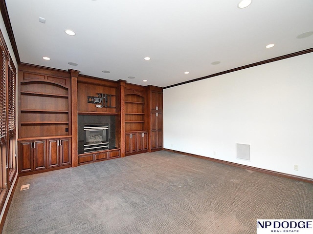 unfurnished living room with carpet flooring and ornamental molding