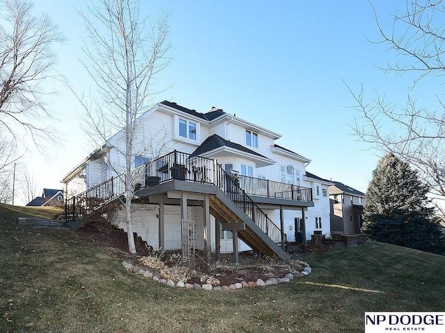 rear view of property featuring a lawn and a wooden deck