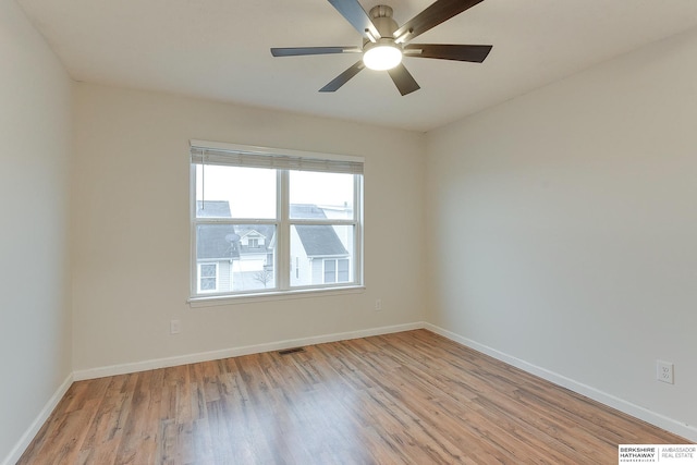 unfurnished room featuring light wood-type flooring and ceiling fan