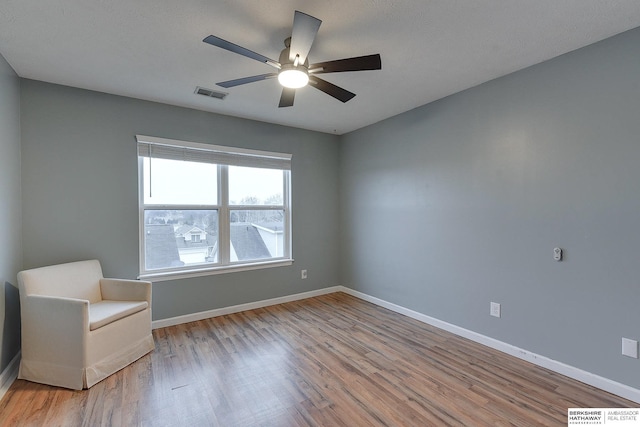 unfurnished room featuring light hardwood / wood-style floors and ceiling fan