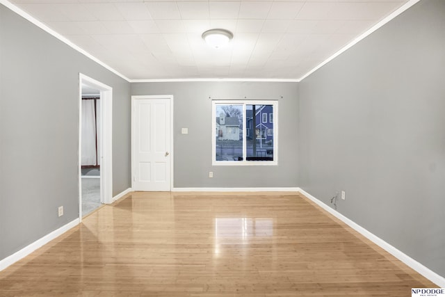 unfurnished room with ornamental molding and light hardwood / wood-style flooring