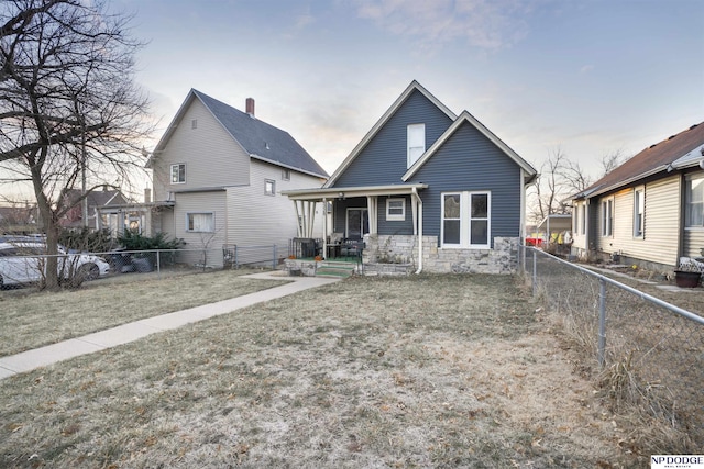 back of property with covered porch