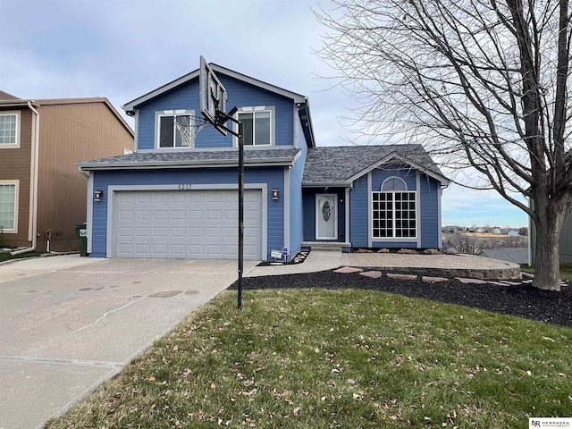 view of front of property with a front lawn and a garage