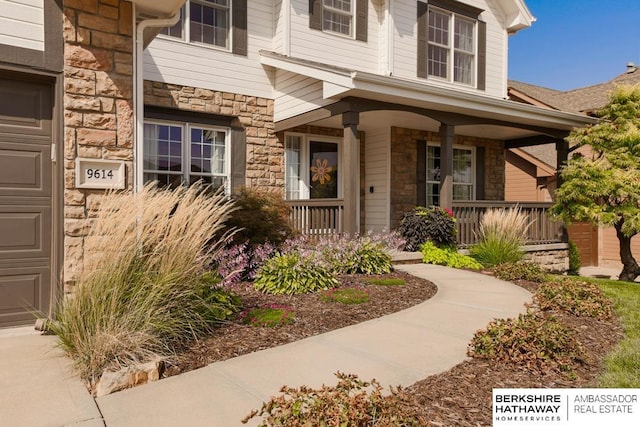 property entrance featuring covered porch