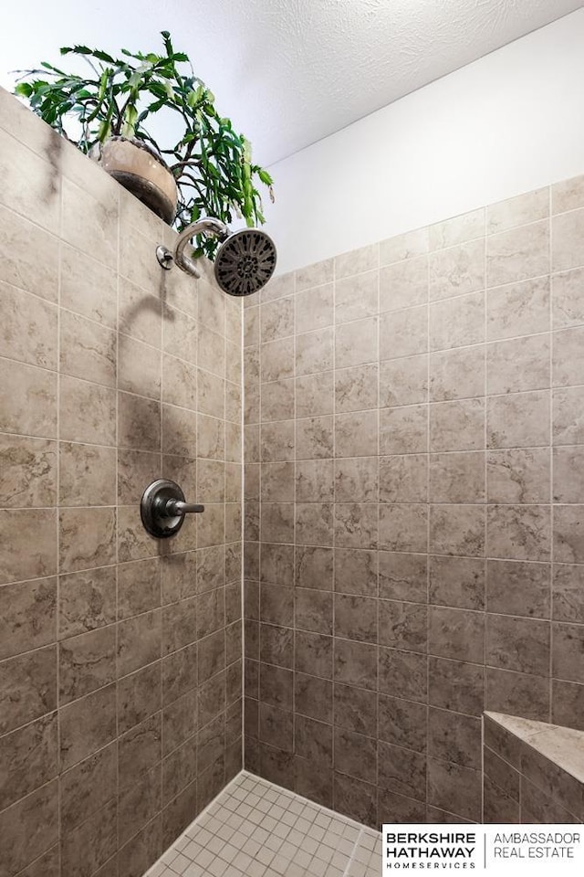 bathroom with tiled shower