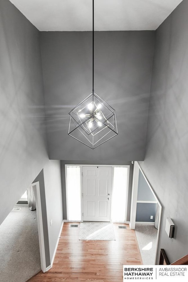 view of carpeted foyer entrance