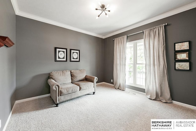 living room featuring carpet flooring, ornamental molding, and a notable chandelier