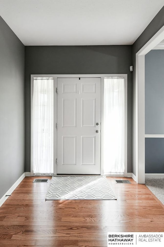 foyer entrance with hardwood / wood-style flooring