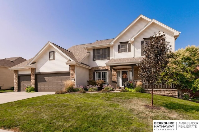 view of front of home with a front lawn and a garage