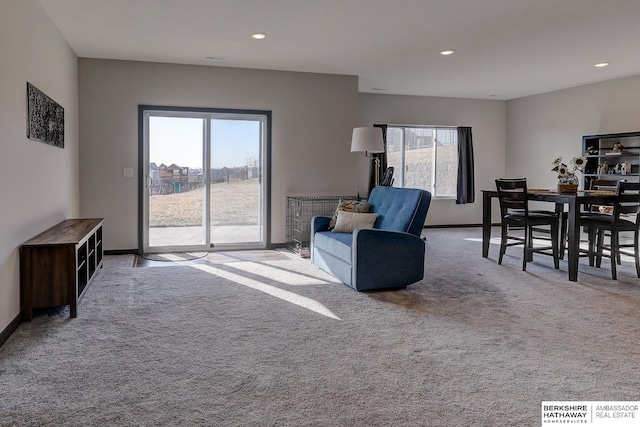 living room featuring light carpet