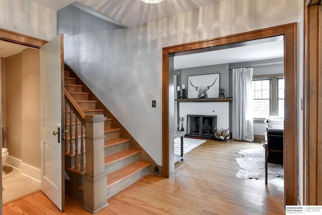 stairs with hardwood / wood-style floors