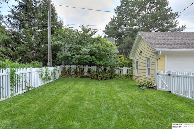 view of yard with a garage