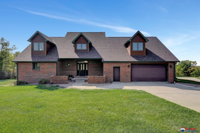 view of front facade with a garage and a front lawn