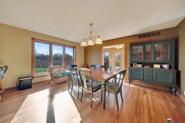 dining area with light hardwood / wood-style flooring