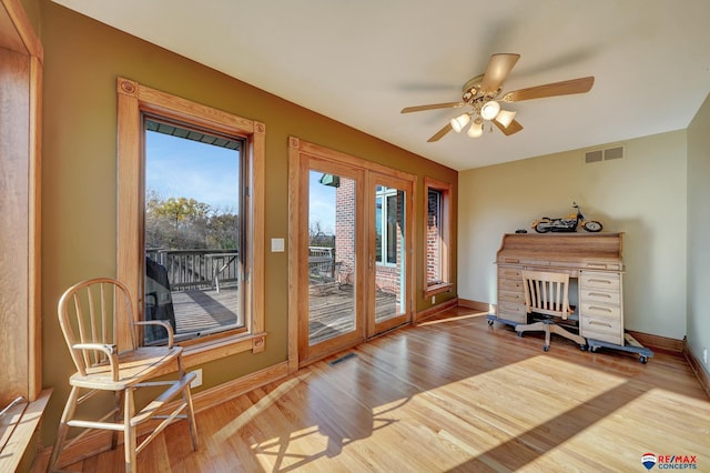 doorway featuring light wood-type flooring, french doors, and ceiling fan