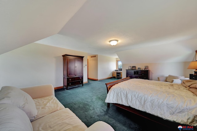 carpeted bedroom featuring lofted ceiling